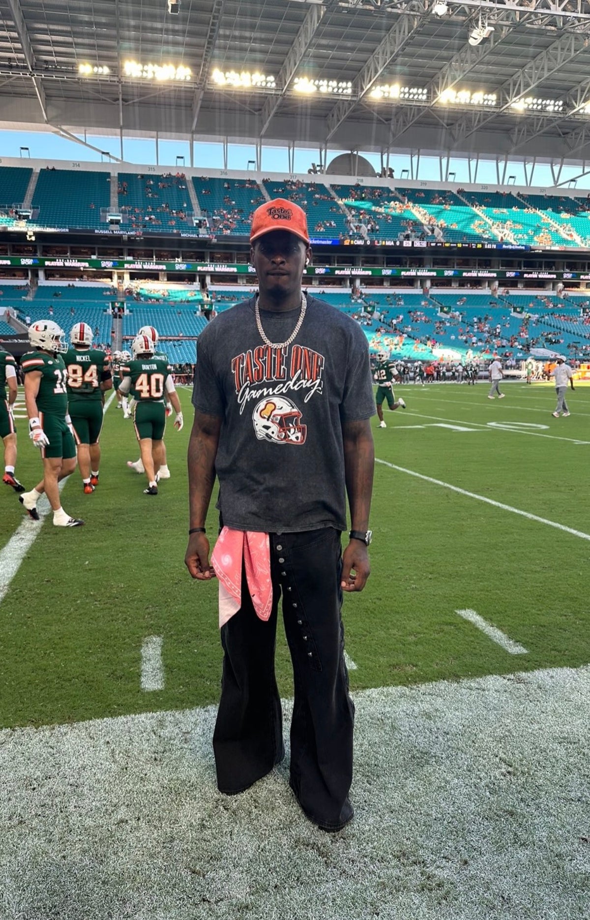 Taste One Gameday Tee worn on the field at Hard Rock Stadium